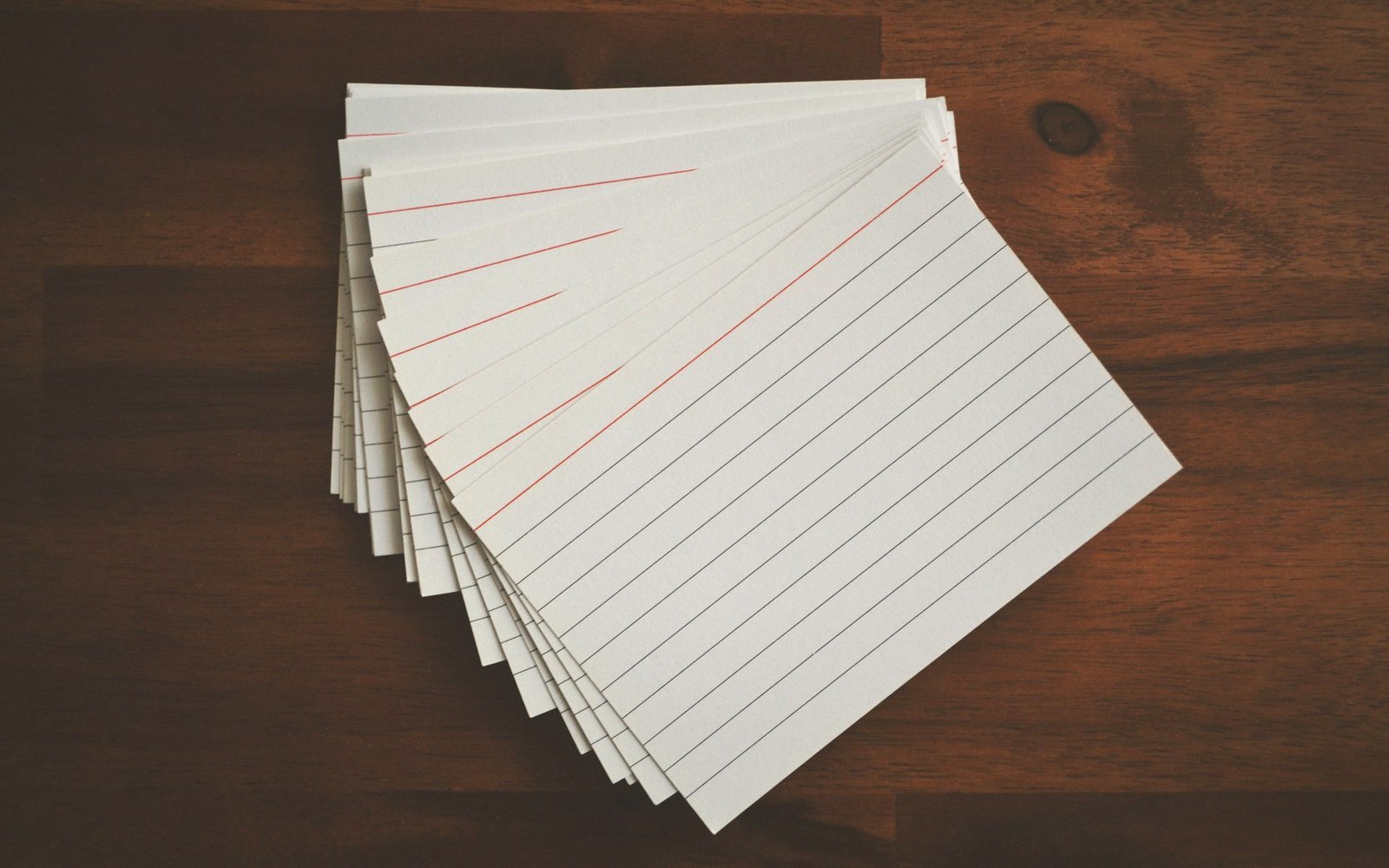 A worn set of index cards fanned out